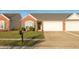 Charming brick home with a well-manicured lawn and attached two-car garage at 198 Rapid Rill Ln, Brownsburg, IN 46112
