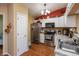 Modern kitchen featuring stainless steel appliances, granite countertops and white cabinets at 198 Rapid Rill Ln, Brownsburg, IN 46112