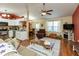 Open concept living area with hardwood floors seamlessly flowing into the kitchen and dining space at 198 Rapid Rill Ln, Brownsburg, IN 46112