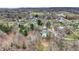 An aerial view of a neighborhood with a river nearby on a sunny day at 207 E Ohio St, Mooresville, IN 46158