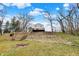 Property features expansive grassy areas, a fire pit, stairs to the river, and beautiful water access at 207 E Ohio St, Mooresville, IN 46158