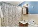 Bathroom featuring a sink with large floral shower curtain at 207 E Ohio St, Mooresville, IN 46158