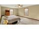 Bright bedroom featuring a double bed, ceiling fan, and two windows at 207 E Ohio St, Mooresville, IN 46158