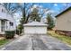 A well-maintained two-car garage with a paved driveway offers convenient parking at 207 E Ohio St, Mooresville, IN 46158