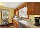 Traditional kitchen with wood cabinets, stainless steel appliances, and double bowl sink at 207 E Ohio St, Mooresville, IN 46158
