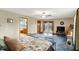 Spacious main bedroom with a ceiling fan, exterior access, and large carpeted floor at 207 E Ohio St, Mooresville, IN 46158