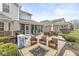 A spacious backyard featuring outdoor seating around a fire pit, grill, and lush landscaping at 209 North Bnd, Greenwood, IN 46142