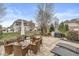 Expansive backyard features a patio with a fire pit, outdoor seating, grilling area, and lush lawn at 209 North Bnd, Greenwood, IN 46142