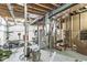 Unfinished basement featuring exposed beams, mechanical equipment, and ample space for storage or future customization at 209 North Bnd, Greenwood, IN 46142