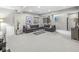 Spacious finished basement with neutral tones, plush carpeting, and a comfortable sectional sofa for relaxation and entertainment at 209 North Bnd, Greenwood, IN 46142