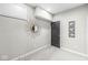Unfinished basement room with gray walls, neutral carpet, and a decorative mirror, offering potential for customization at 209 North Bnd, Greenwood, IN 46142