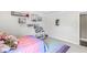 Well-lit ' bedroom with shelving, colorful books, and plush decor at 209 North Bnd, Greenwood, IN 46142