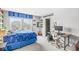 Bedroom with large windows, desk, and bed with blue bedding at 209 North Bnd, Greenwood, IN 46142