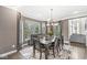 Elegant dining room with large windows, stylish furnishings, and natural light at 209 North Bnd, Greenwood, IN 46142