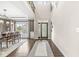 Bright foyer featuring an ornate front door, hardwood flooring, high ceilings and views into the dining room at 209 North Bnd, Greenwood, IN 46142