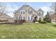 Beautiful two-story home with a well-maintained lawn, blue shutters and a beautifully landscaped front yard at 209 North Bnd, Greenwood, IN 46142