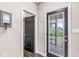 Hallway view of the main door of the property with decorative mirror and hardwood floors at 209 North Bnd, Greenwood, IN 46142
