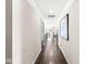 Clean hallway with hardwood floors, neutral walls, and recessed lighting at 209 North Bnd, Greenwood, IN 46142