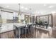 Well-designed kitchen with granite island, stainless steel appliances and hardwood floors at 209 North Bnd, Greenwood, IN 46142
