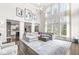 Bright living room featuring a large sectional couch, high ceilings, and elegant decor at 209 North Bnd, Greenwood, IN 46142