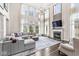 Spacious living room with high ceilings, large windows, and a fireplace at 209 North Bnd, Greenwood, IN 46142