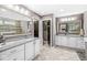 Spacious main bathroom featuring double vanity, tile flooring, and plenty of storage at 209 North Bnd, Greenwood, IN 46142
