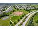 An aerial view of a community featuring a basketball court and multiple tennis courts for recreational activities at 2324 Boneset Dr, Plainfield, IN 46168