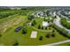Aerial view of the community park featuring a playground, pool, beach volleyball court, and gazebo at 2324 Boneset Dr, Plainfield, IN 46168