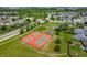 Aerial image of community tennis and basketball courts surrounded by green spaces and walking trails at 2324 Boneset Dr, Plainfield, IN 46168