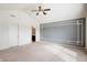 Large main bedroom with a ceiling fan, carpeted floors, and a decorative wall accent at 2324 Boneset Dr, Plainfield, IN 46168