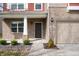 Close up of front door and garage; brick and siding combination at 2324 Boneset Dr, Plainfield, IN 46168
