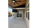 Covered patio with mounted TV and wood ceiling is ideal for outdoor gatherings and relaxation at 2324 Boneset Dr, Plainfield, IN 46168