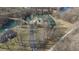 Beautiful aerial view of an estate surrounded by a private lake and mature trees at 2437 W Wavelyn N Cir, Martinsville, IN 46151