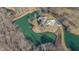 Aerial view of a brick house and a pond at 2437 W Wavelyn N Cir, Martinsville, IN 46151