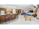 Finished basement with a bar area, pool table, and cozy seating, perfect for entertaining guests at 2437 W Wavelyn N Cir, Martinsville, IN 46151