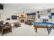 Finished basement featuring a pool table, fireplace, and leather furniture at 2437 W Wavelyn N Cir, Martinsville, IN 46151