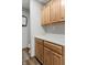 Storage available in this bathroom with quartz countertops and beautiful oak cabinets at 2437 W Wavelyn N Cir, Martinsville, IN 46151