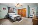 Charming bedroom with soothing color palette, plush bed, closet, and vanity for relaxation and comfort at 2437 W Wavelyn N Cir, Martinsville, IN 46151