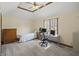 Cozy bedroom with natural light, a bed, a desk, and carpeted flooring for warmth and comfort at 2437 W Wavelyn N Cir, Martinsville, IN 46151