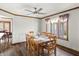 Sunlit dining room featuring chandelier lighting and a large picture window at 2437 W Wavelyn N Cir, Martinsville, IN 46151
