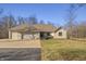 Charming single-story home with a three car garage and well-maintained lawn at 2437 W Wavelyn N Cir, Martinsville, IN 46151