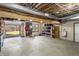 Spacious garage with storage shelves and an open garage door at 2437 W Wavelyn N Cir, Martinsville, IN 46151