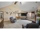 Spacious living room featuring soaring ceilings, a fireplace and natural light at 2437 W Wavelyn N Cir, Martinsville, IN 46151