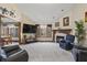 Cozy living room showcasing a fireplace, natural light and comfortable furniture at 2437 W Wavelyn N Cir, Martinsville, IN 46151