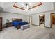 Primary bedroom with tray ceilings, a walk-in closet, and ample natural light at 2437 W Wavelyn N Cir, Martinsville, IN 46151