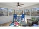Enclosed sunroom featuring multiple windows, plenty of light, and comfortable lounge furniture at 2437 W Wavelyn N Cir, Martinsville, IN 46151
