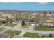 Expansive aerial view captures a well-maintained neighborhood with tidy homes and a community park at 3013 E 7Th St, Anderson, IN 46012