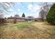 Spacious backyard with lush greenery and a well-maintained lawn at 3013 E 7Th St, Anderson, IN 46012