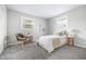 Sun-filled bedroom with white walls, a comfortable bed, and cozy decor at 3013 E 7Th St, Anderson, IN 46012