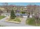 Charming single-story home featuring a well-manicured lawn, driveway, and attached garage at 3013 E 7Th St, Anderson, IN 46012